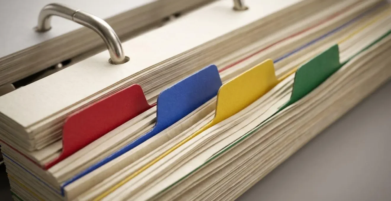 Organized health binder with color-coded sections showing medical information ready for emergency room visits